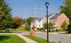 Photograph of landscape around a house and power