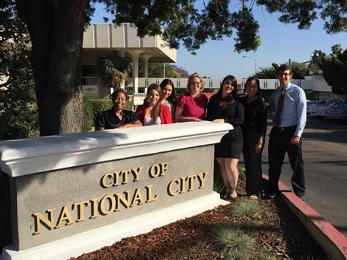 San Diego State students post in front of National City Hall