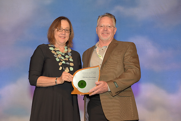 David Malcolm accepts Excellence in Strategic Collaboration Award for High Sierra Showerheads.