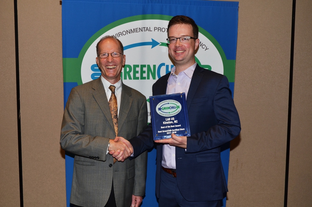 Matt Finnell accepts Lidl US' Best of the Best recognition from Tom Land of the EPA GreenChill Program