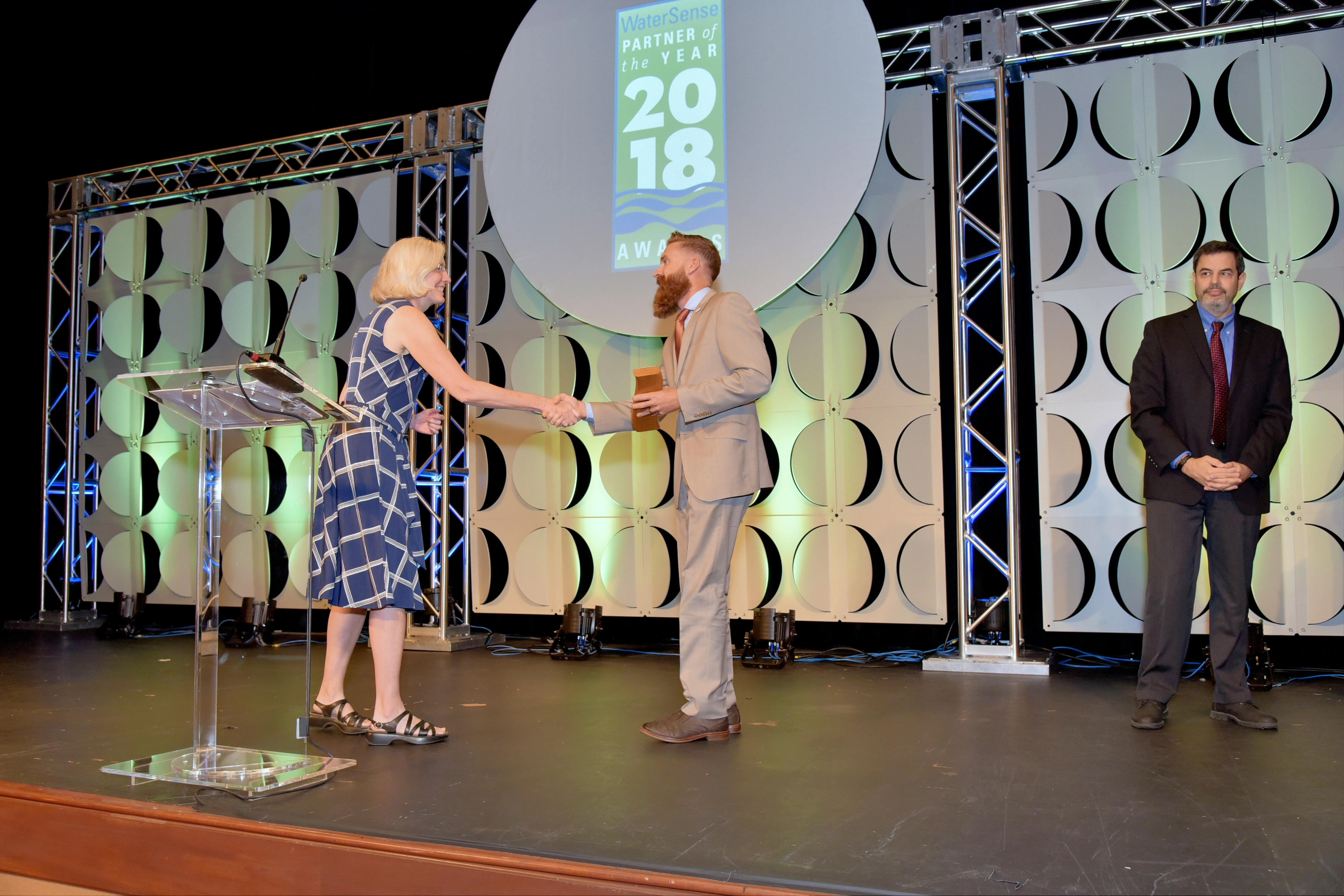 Bryce Carnehl accepts Excellence in Labeled Products in the Marketplace Award for Hunter Industries.