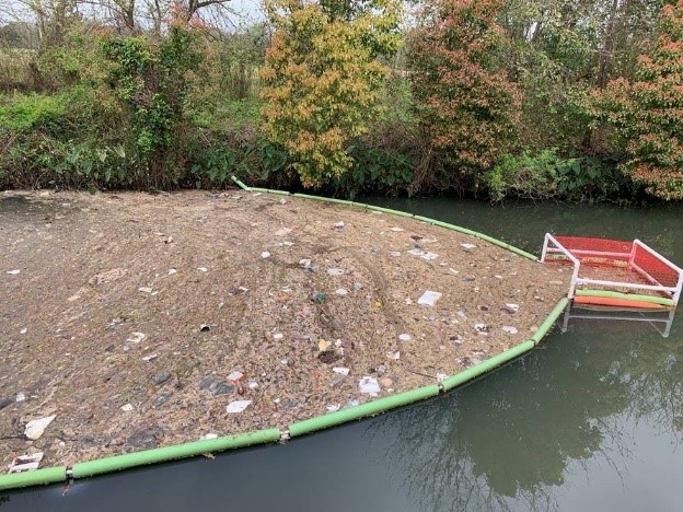 Three Mile Creek trash capture device. Photo courtesy of Laura Stone.