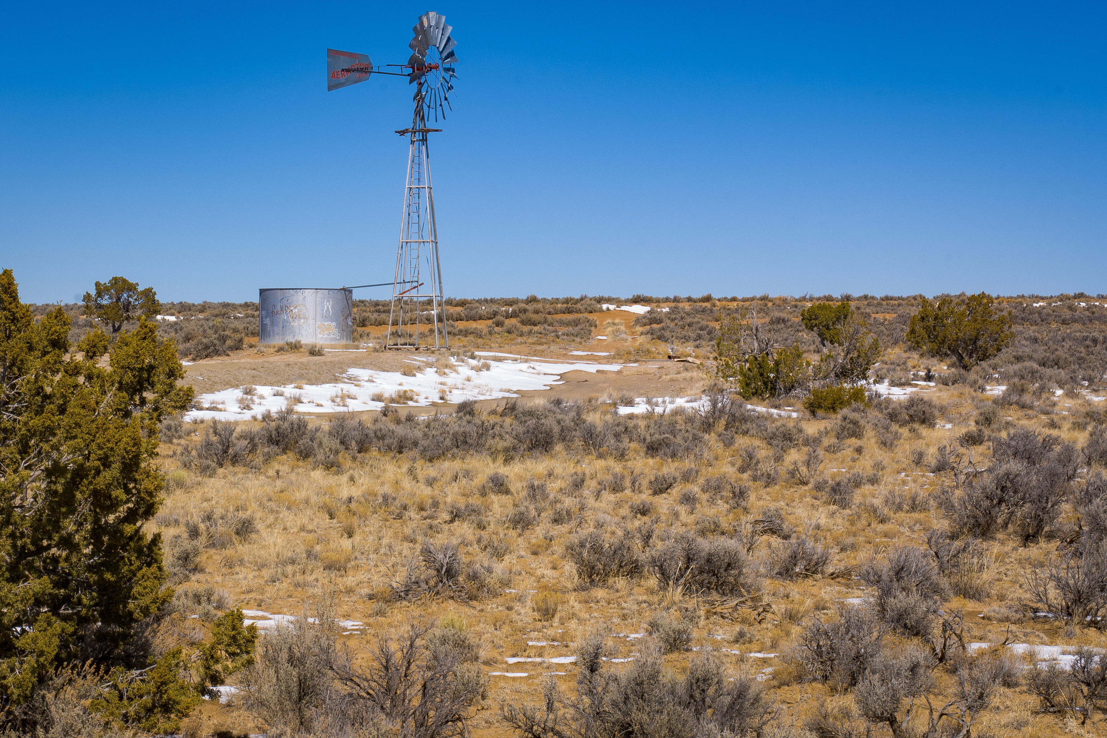 View of a water tank and windmill