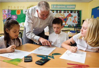 A picture of a schoolteacher helping a child with homework.