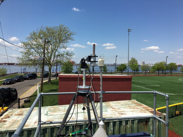 This is on the top of the NJ Department of the Environment Bayonne, NJ air quality monitoring shelter with a spectrometer and weather station.