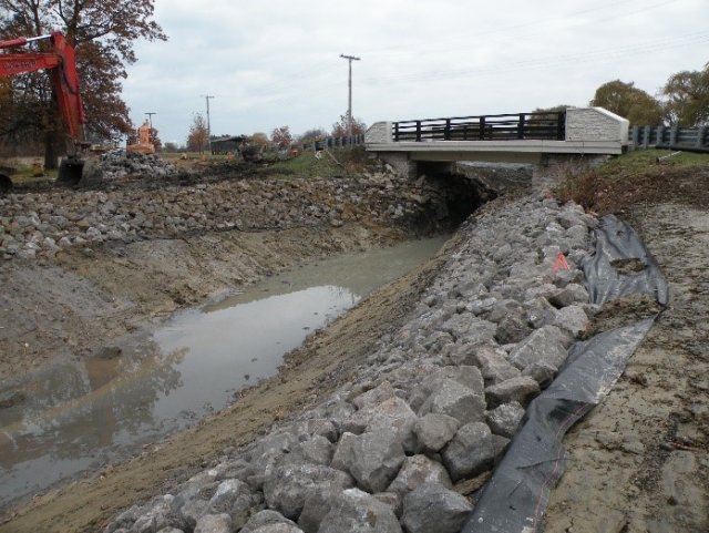 Photo of A stop-log weir was replaced with a 50'-wide opening and road bridge to reconnect the Blue Heron Lagoon and Lake Okonoka.