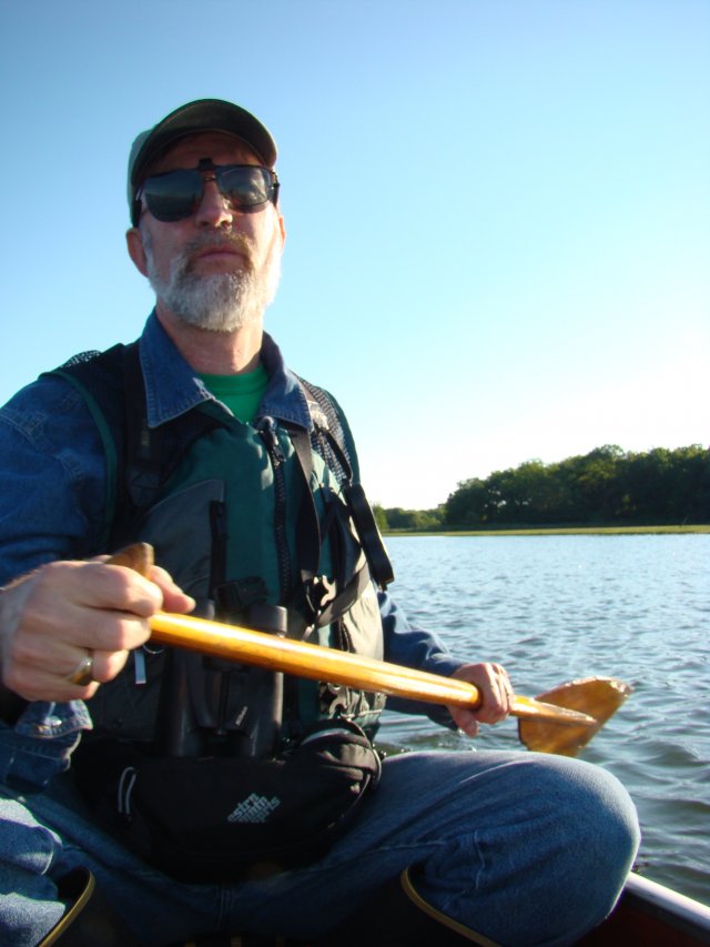 Walter Berry paddles a canoe