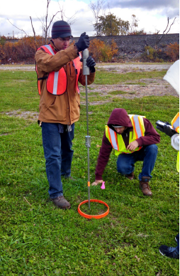 The field crew performs a penetration test using a single mass penetrometer.  Photo credit: Tetra Tech.