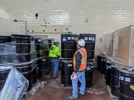 labeling drums of Nickel Cadmium batteries at Battery and Electronics Inc