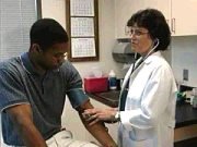 Doctor shown interviewing an EPA clinical study volunteer.