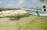 Photo of EPA boat docked along a beach