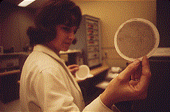 technician holds up an air filter