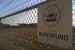 picture of an EPA sign on a fence outside of a superfund site