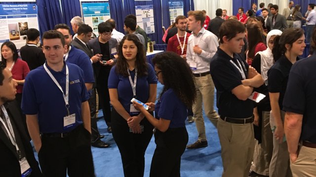 A crowd of people visiting different P3 posters and projects