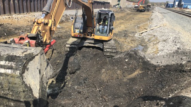 Excavator working along the north track