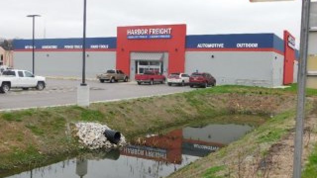 Image of a large retail store and parking lot. 