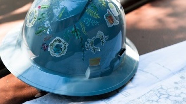 Hard hat sitting on blue prints