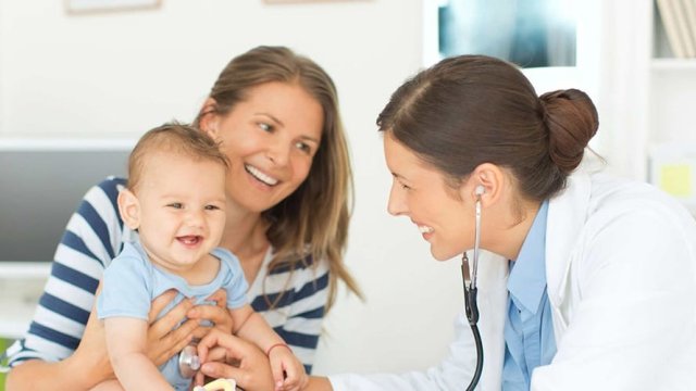 Mom and baby with Doctor