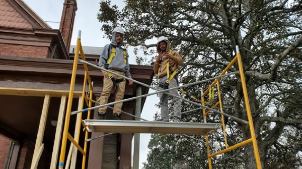 Eugene on scaffolding in Tuskegee, AL at Groundwork USA training