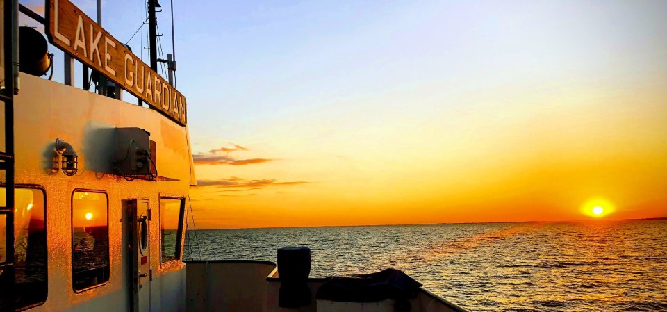 Lake Guardian boat with sunset