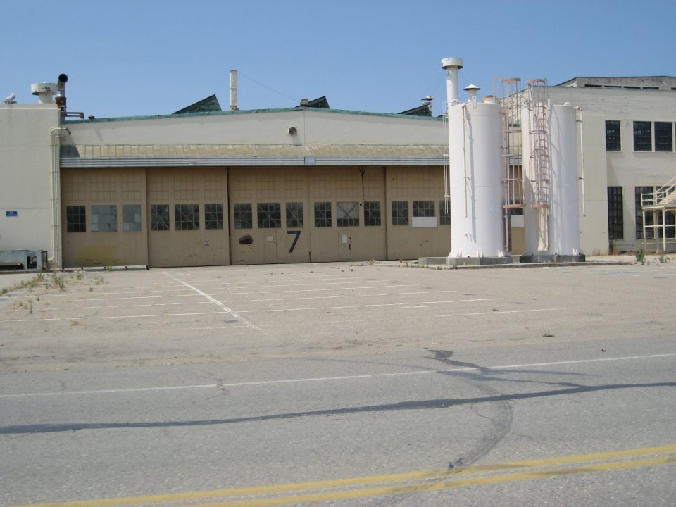 A parking lot and industrial building.