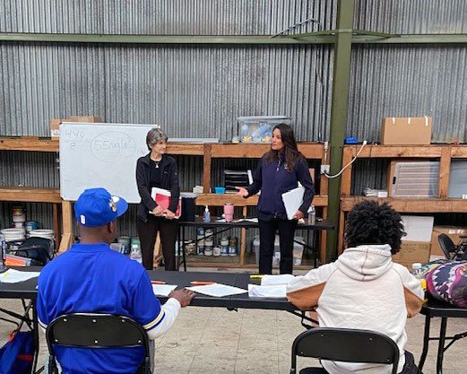 Deputy Administrator Janet McCabe, standing in front of the white board, next to Regional Administrator Martha Guzman, at the Hunter’s Point