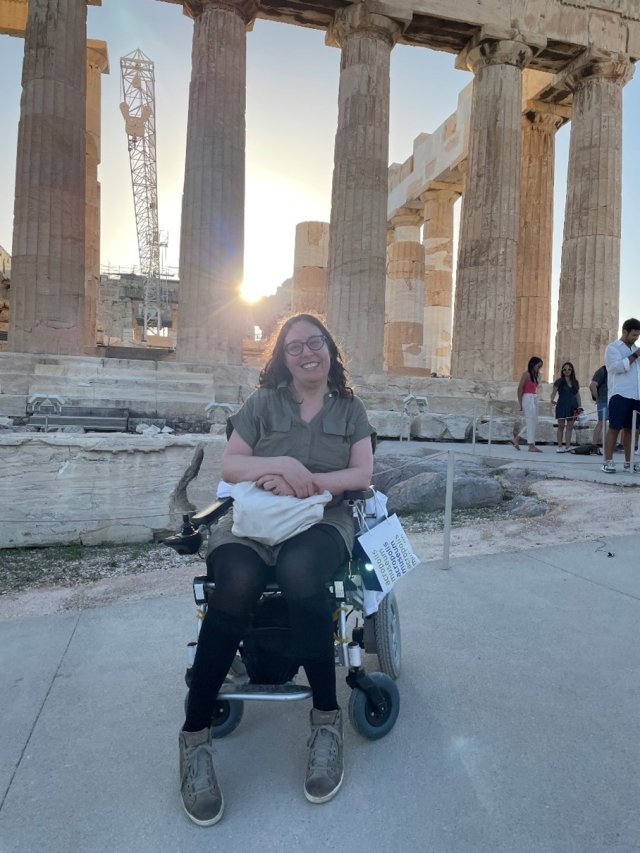 EPA Epidemiologist Rebecca Massa Nachman posing smiling in front of a historical ruin site