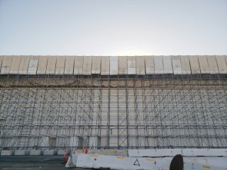 Exterior of Segment 3 building showing scaffolding across the facade.