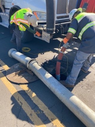 Workers inspecting sewer lines on Maui