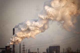 Smoke rising from industrial smokestack