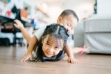 Kids playing on the floor together