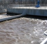 Image of wastwater in large cement treatment units.